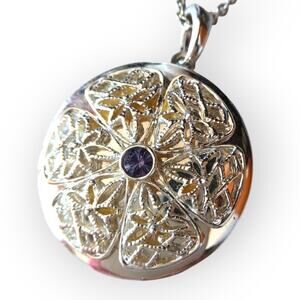 Bright silver tone filigree style locket necklace